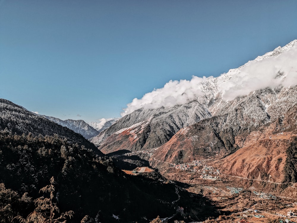 a view of a mountain range with snow on the top