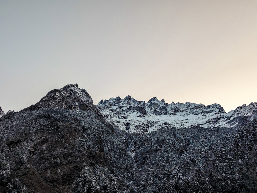 a view of a mountain range with snow on the top