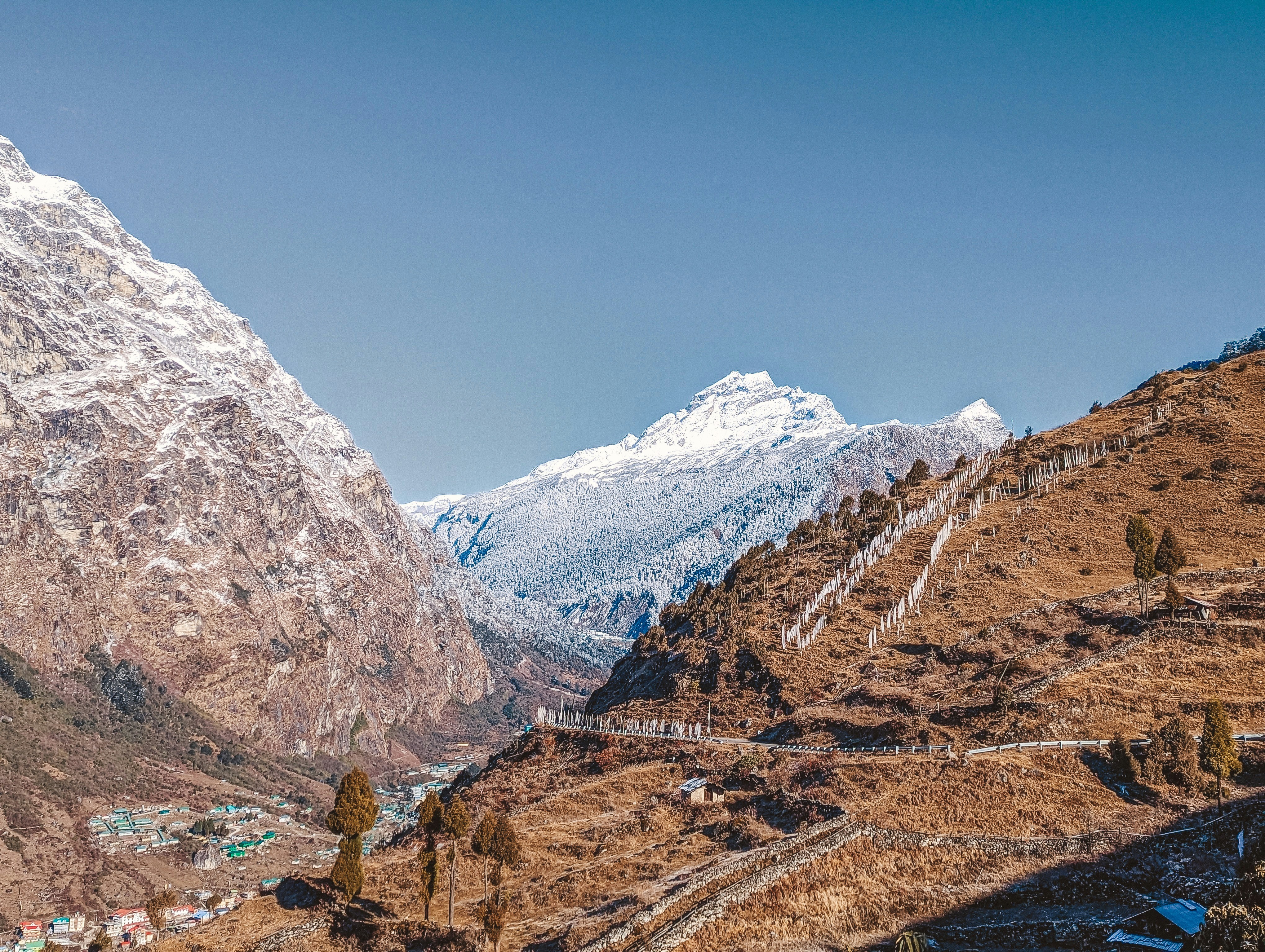 a view of a snow covered mountain from a distance