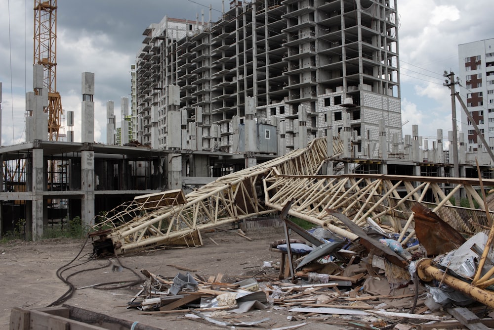 a pile of rubble sitting in front of a tall building