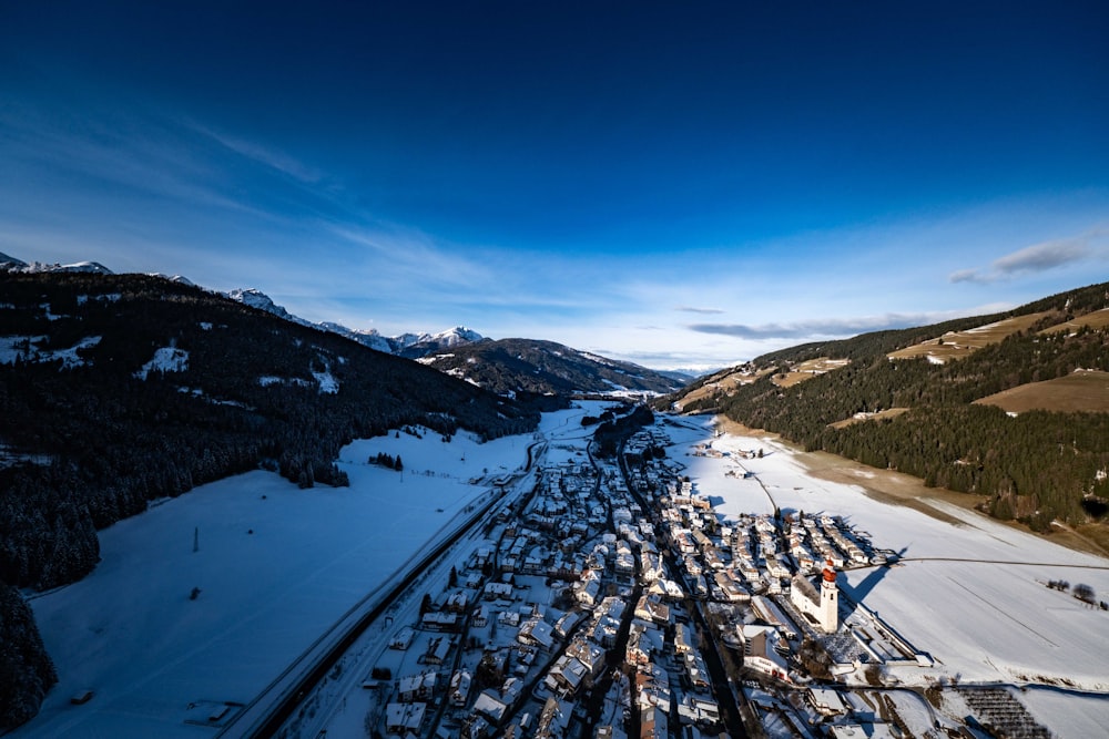 an aerial view of a ski resort in the mountains