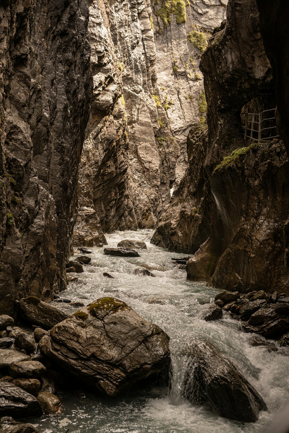 a river running through a narrow rocky canyon