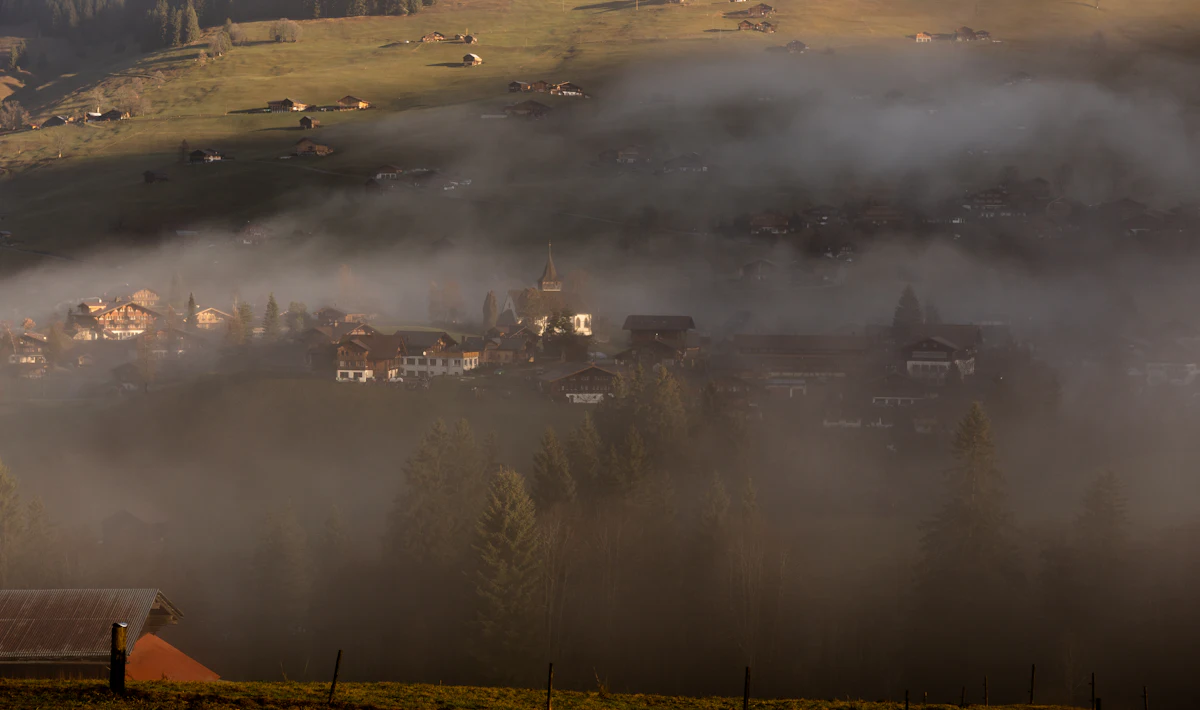 Morning mist over a valley in the Bernese Oberland