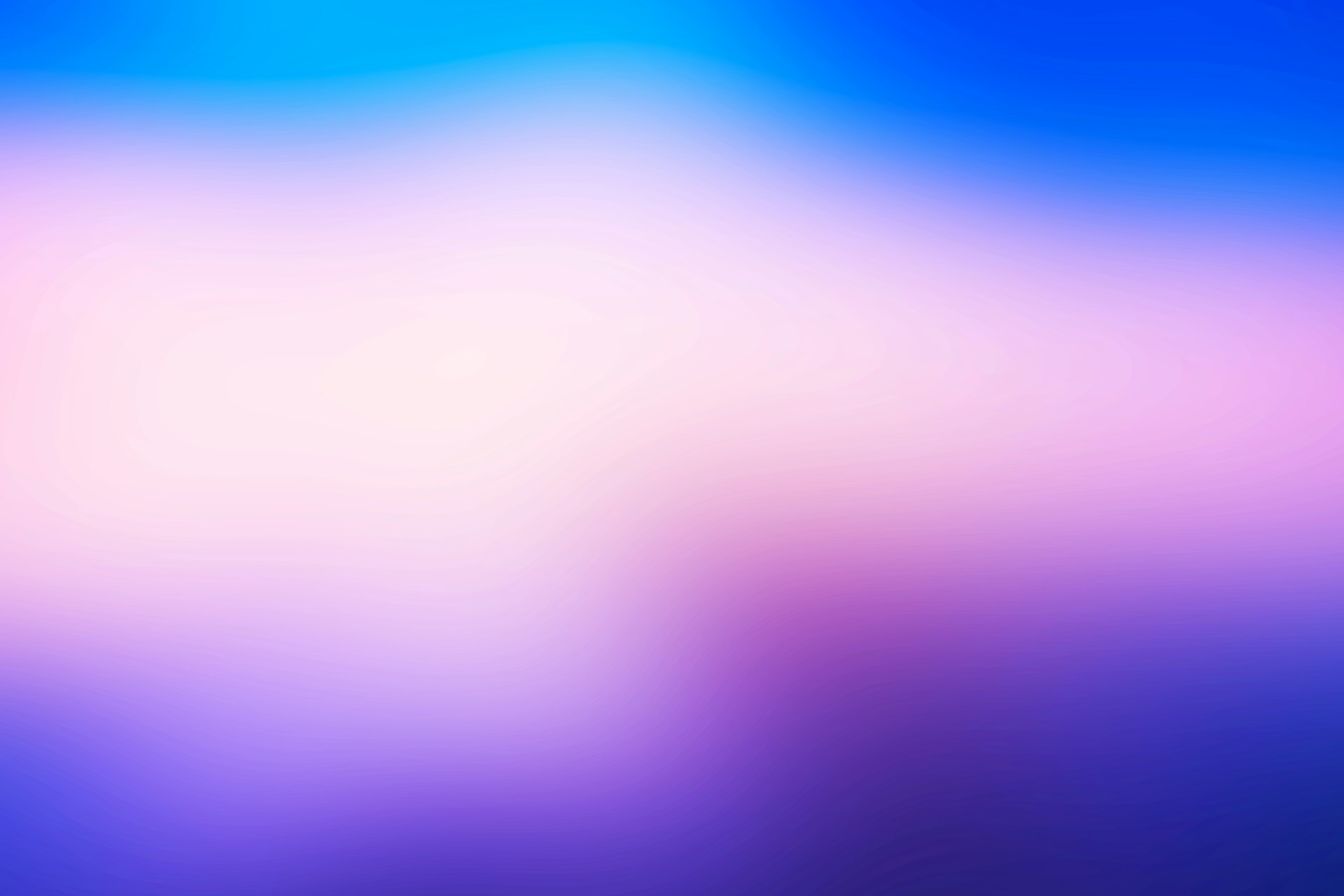 a blurry image of a blue and pink background