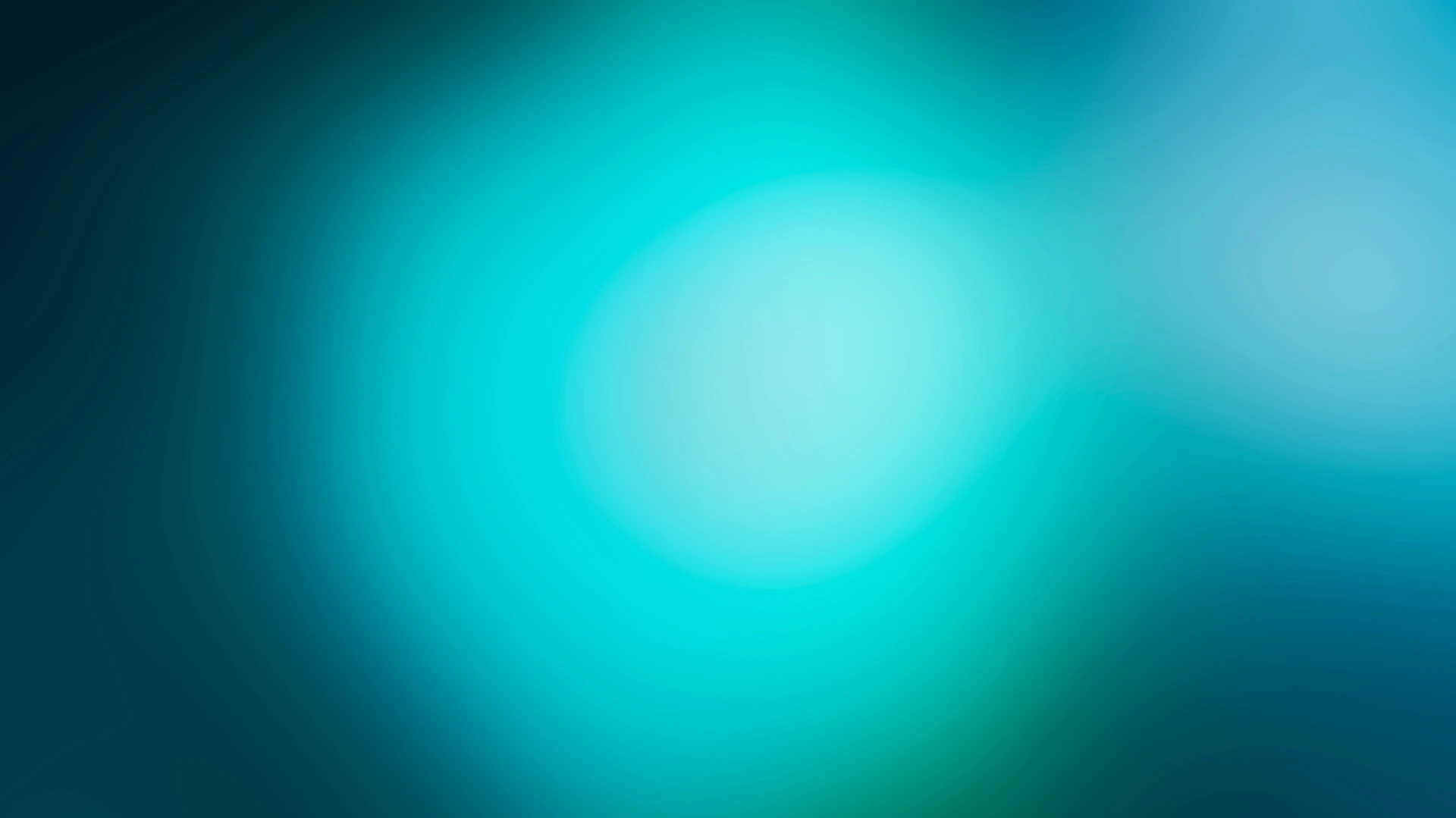 a blurry blue and green background with circles
