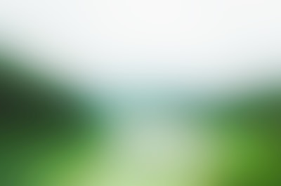 a blurry image of a green and white background