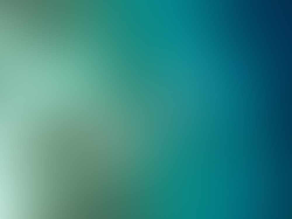 a blurry image of a blue and green background