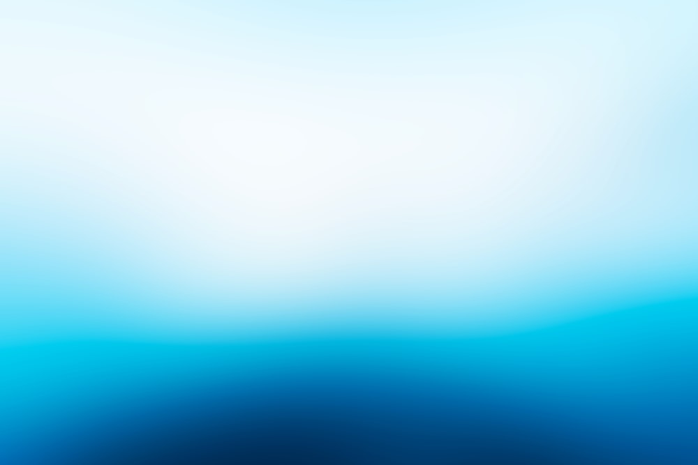 a blurry blue background with a white center