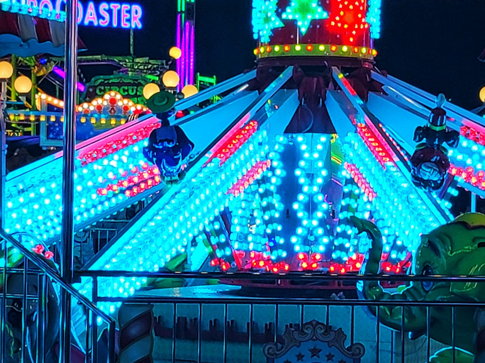 a merry go round ride lit up at night