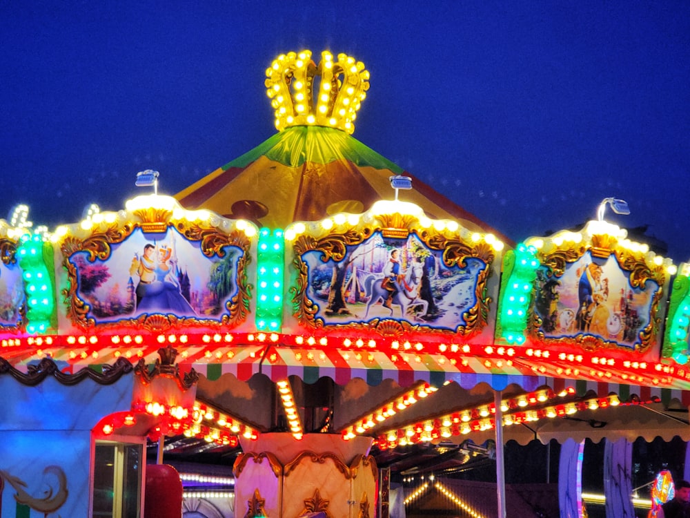 a merry go round at night with lights on