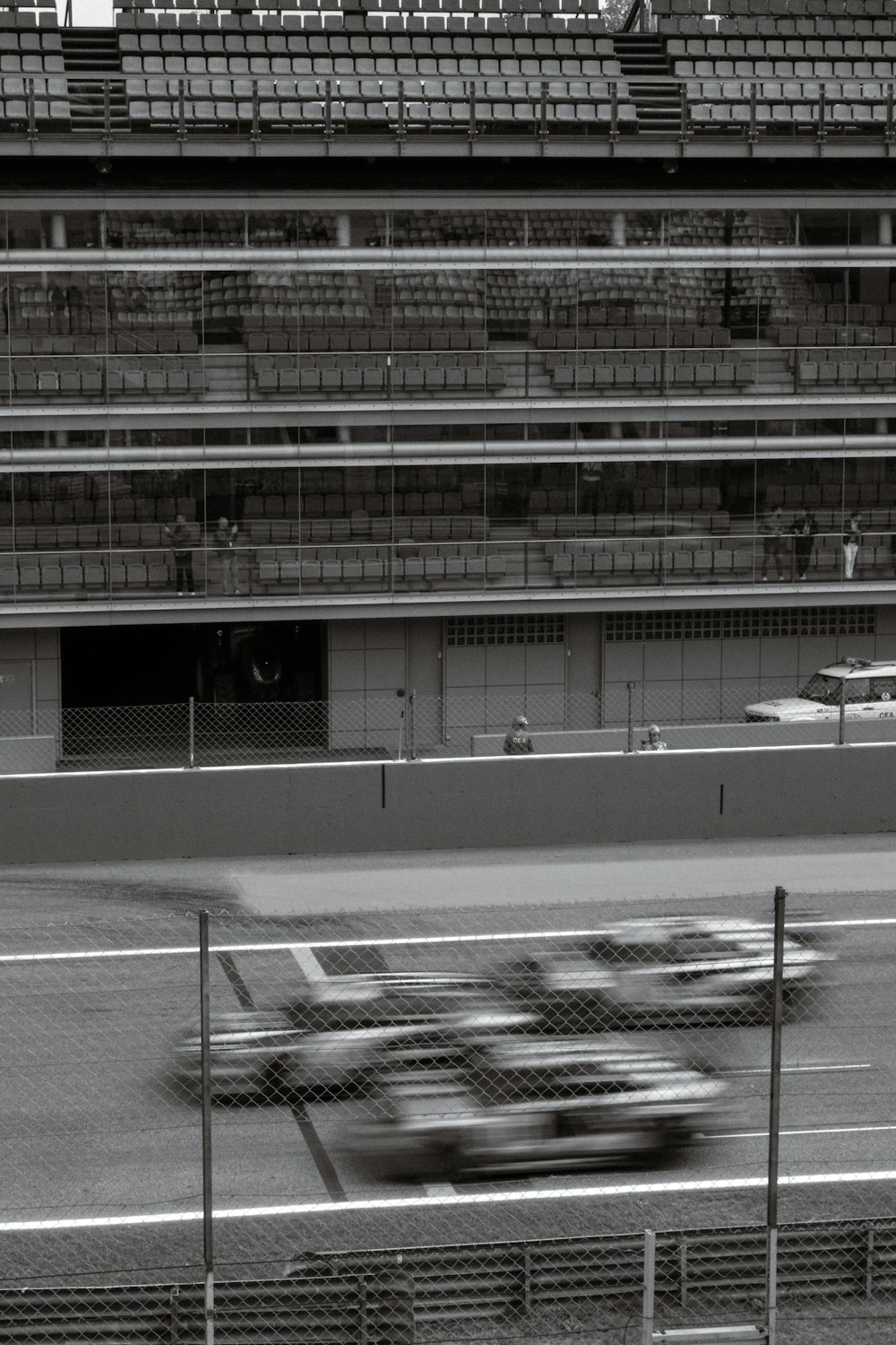a black and white photo of a race track