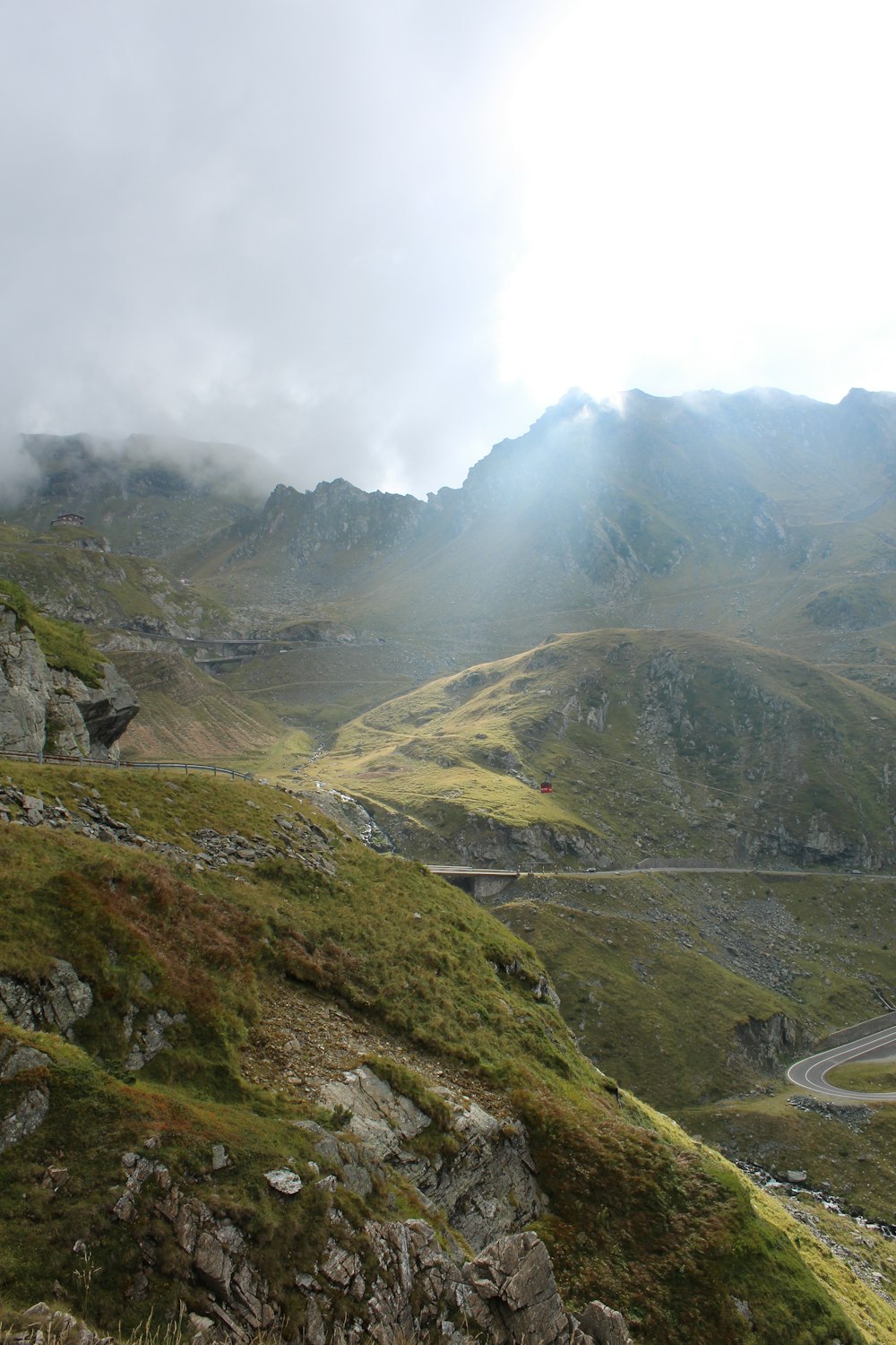 a view of a winding road in the mountains