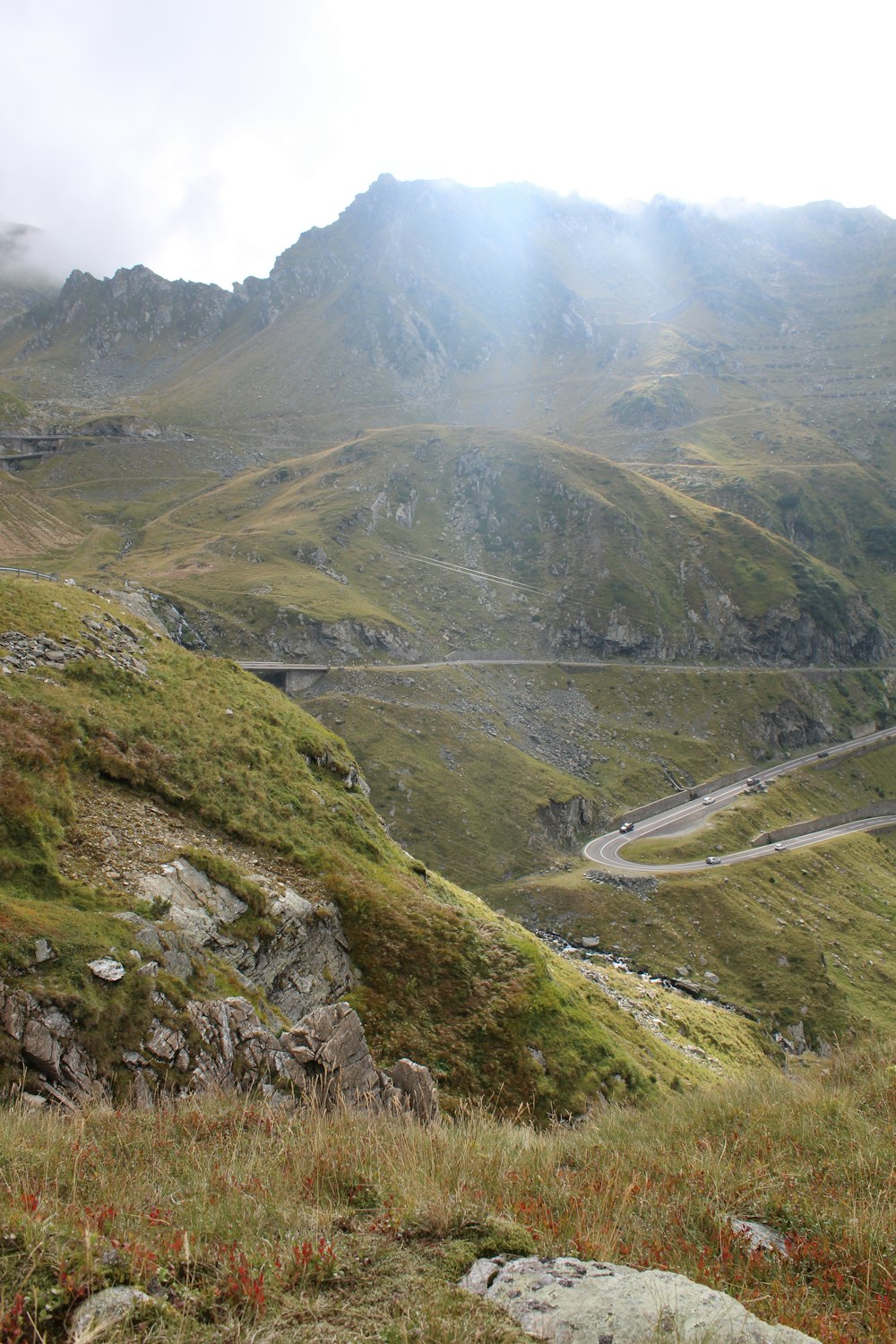 a view of a winding road in the mountains