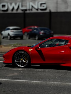 a red sports car parked in a parking lot