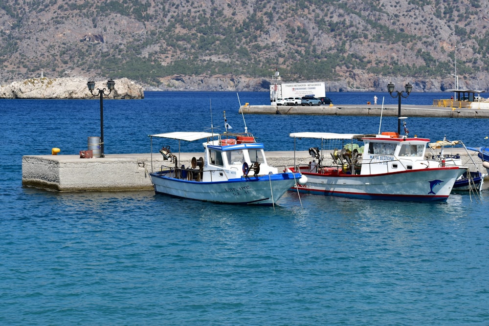 a couple of boats that are sitting in the water