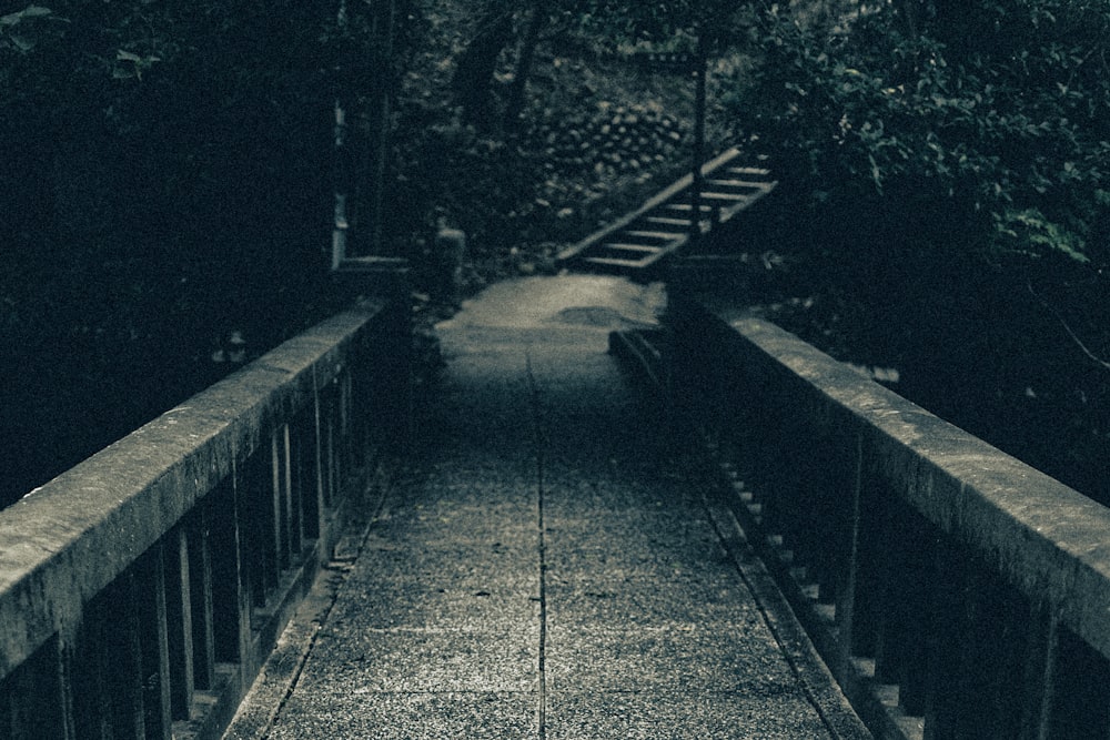 a black and white photo of a walkway