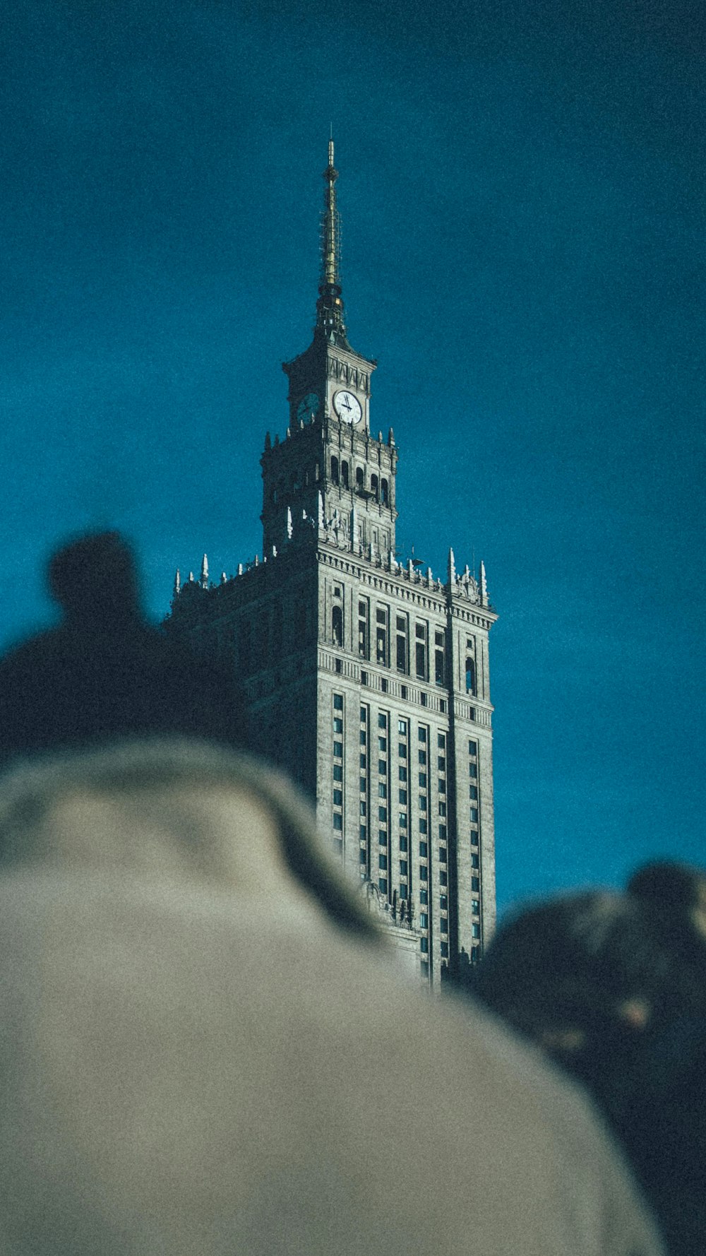 a tall building with a clock on the top of it