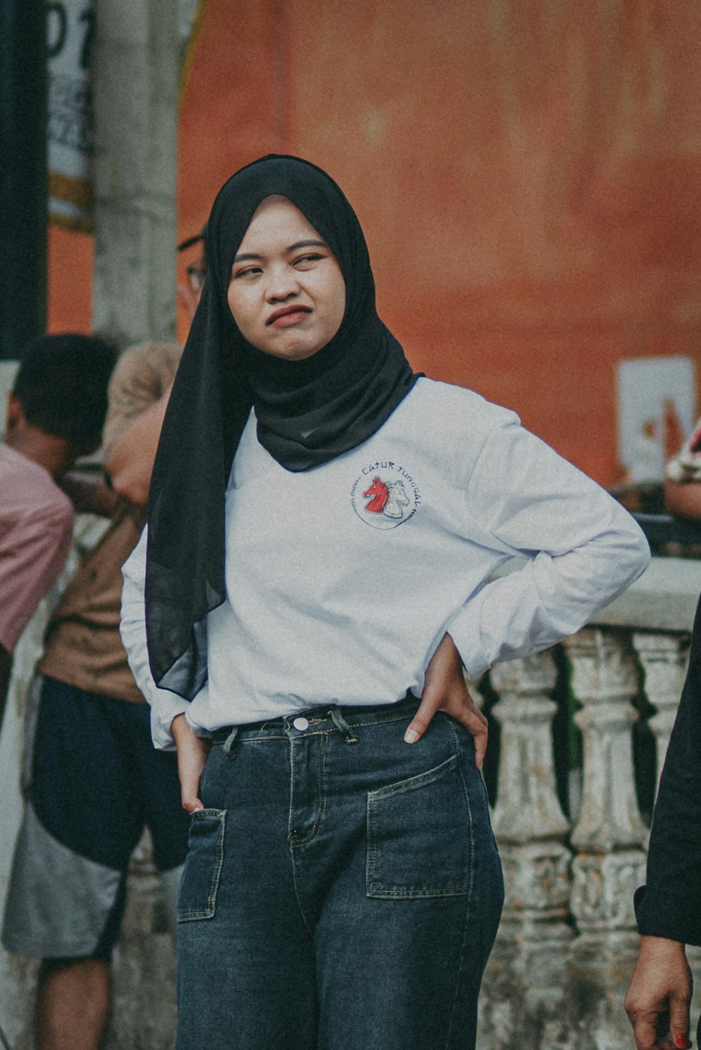 a woman standing in front of a group of people