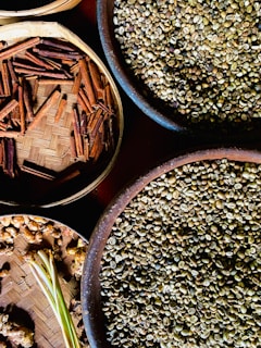 several bowls filled with different types of seeds