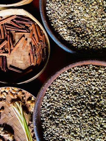 several bowls filled with different types of seeds