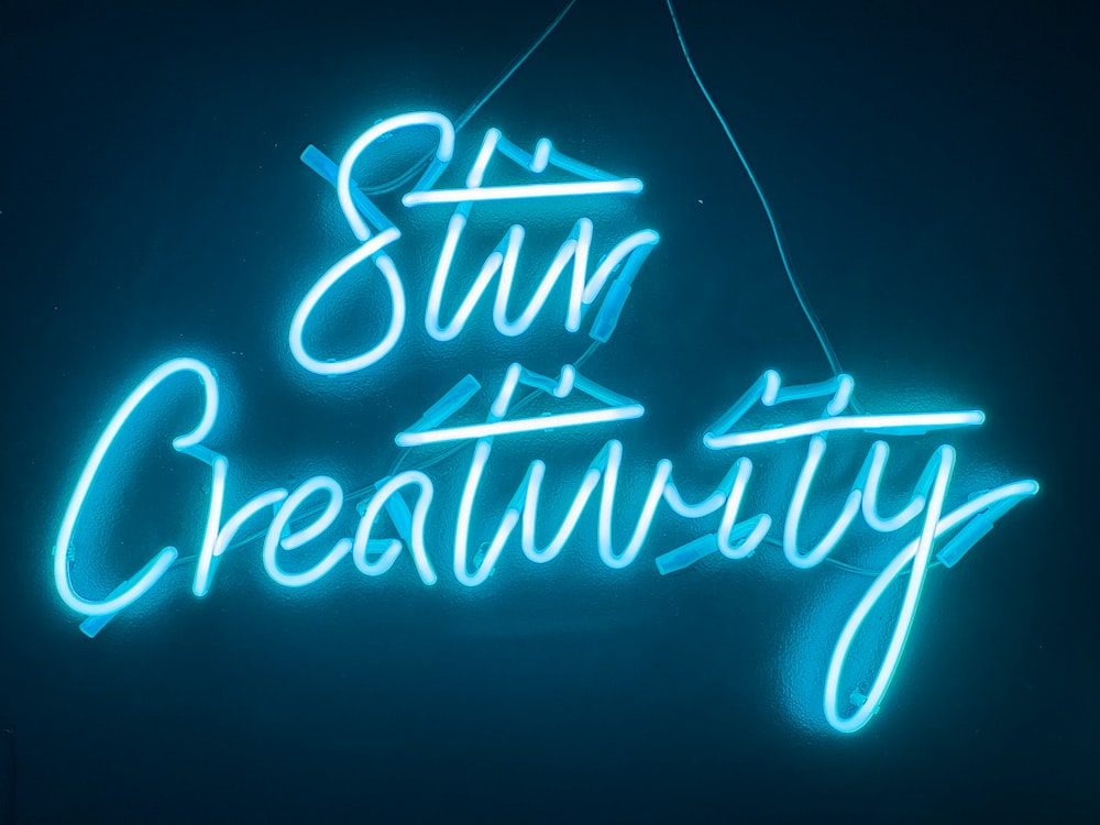 a neon sign that says sun and creativity