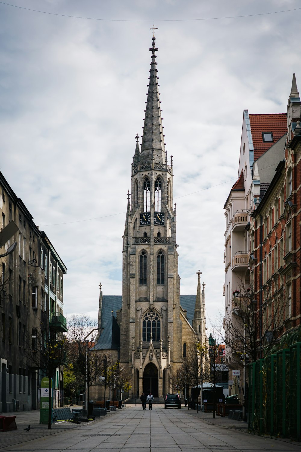 a large cathedral towering over a city filled with tall buildings