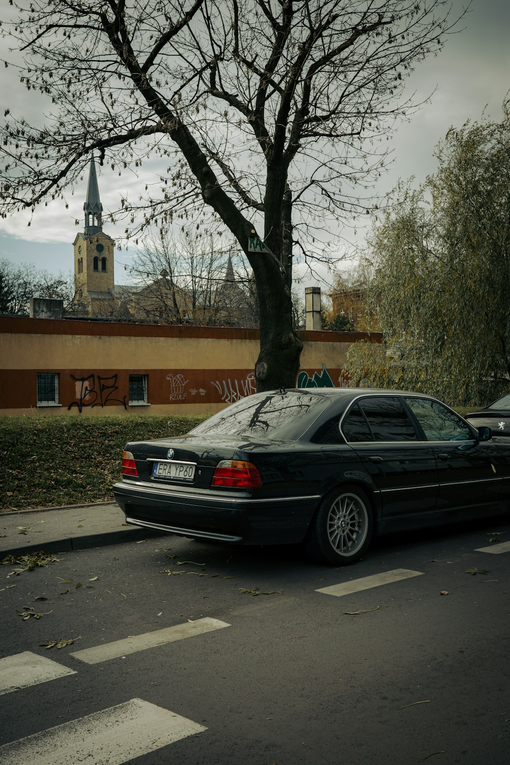 a black car parked on the side of the road