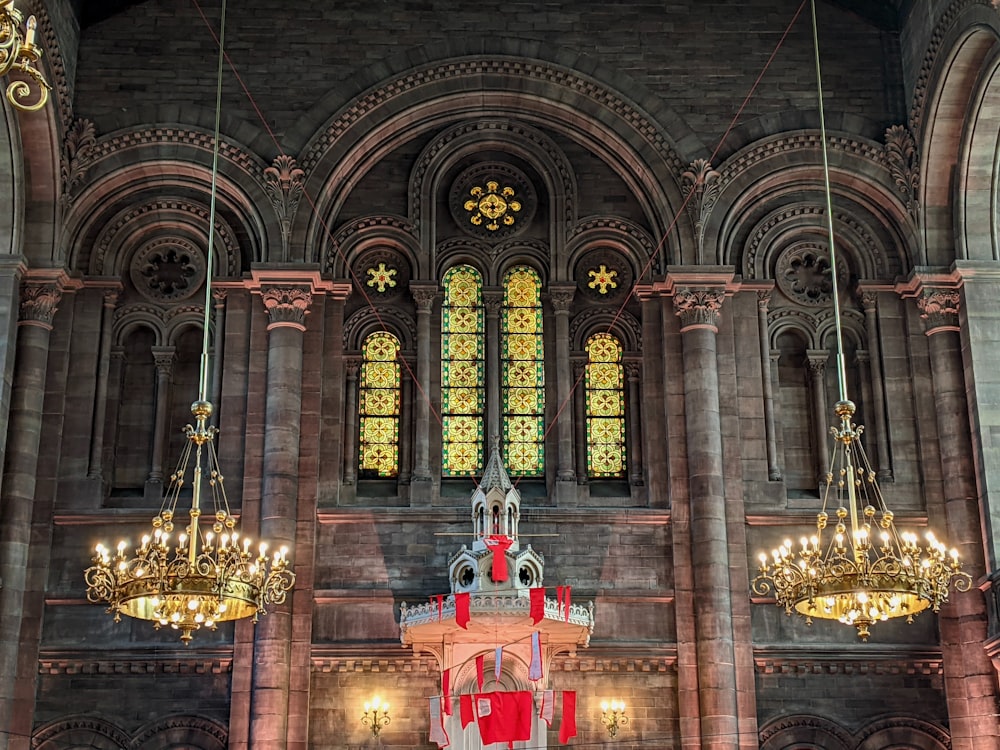 a large cathedral with chandeliers hanging from the ceiling