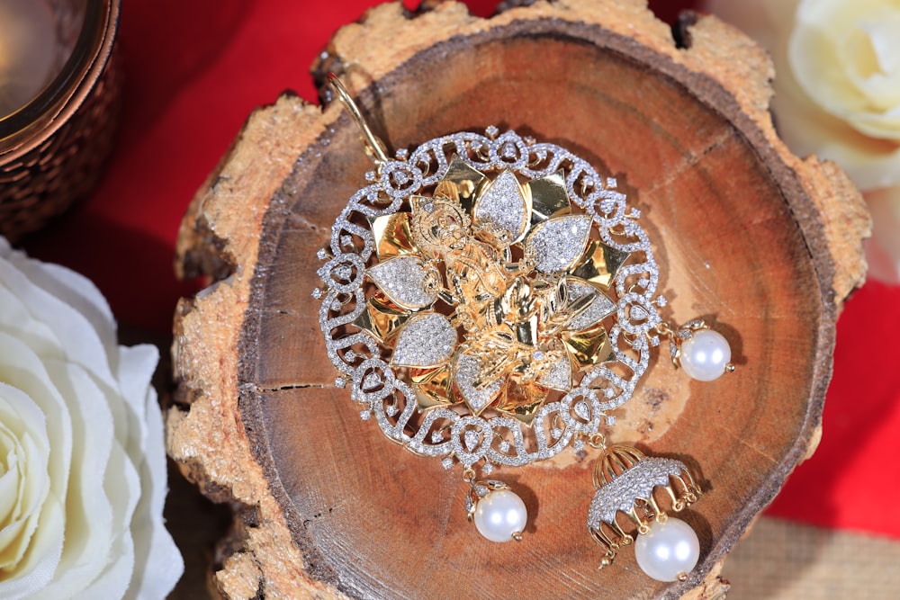 a piece of jewelry sitting on top of a tree stump