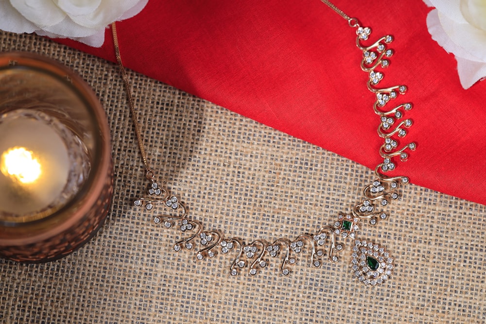 a close up of a necklace on a table