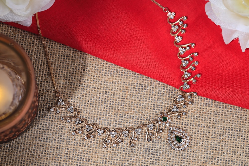 a close up of a necklace on a table