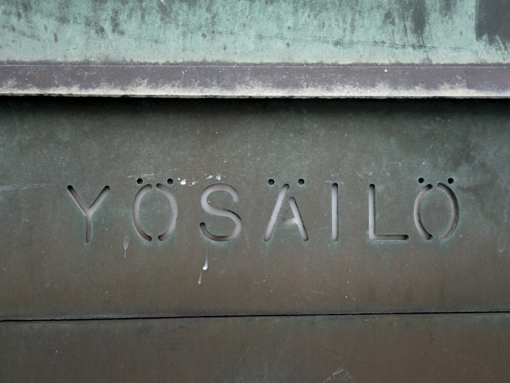 the word yosailo written on the side of a building