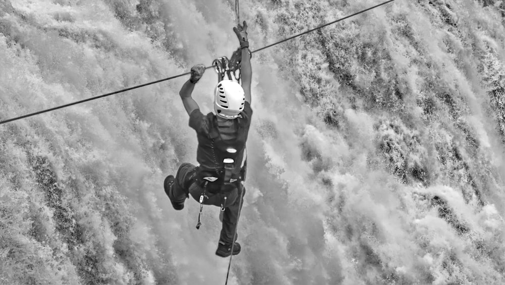 a man on a rope high up in the air