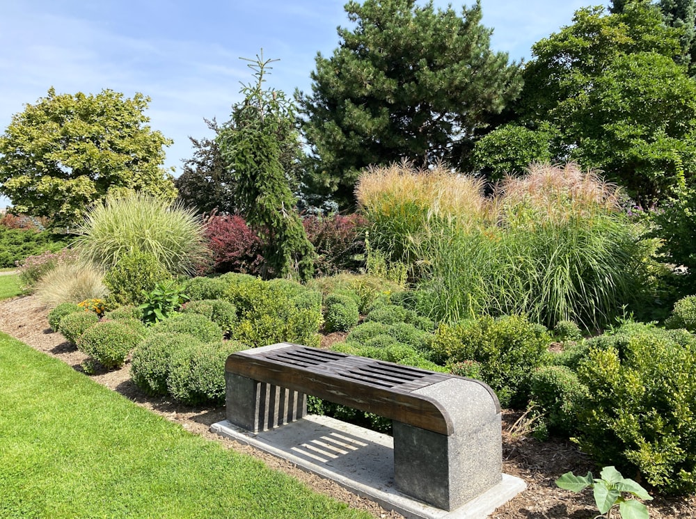 a bench sitting in the middle of a garden