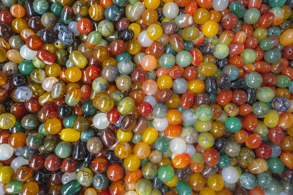 a bunch of marbles that are all different colors