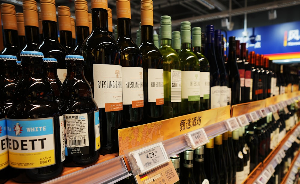 a store shelf filled with lots of bottles of wine