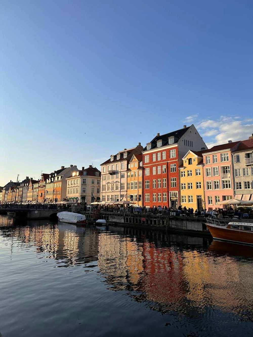 a row of buildings next to a body of water