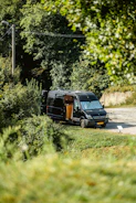 a van is parked on the side of the road