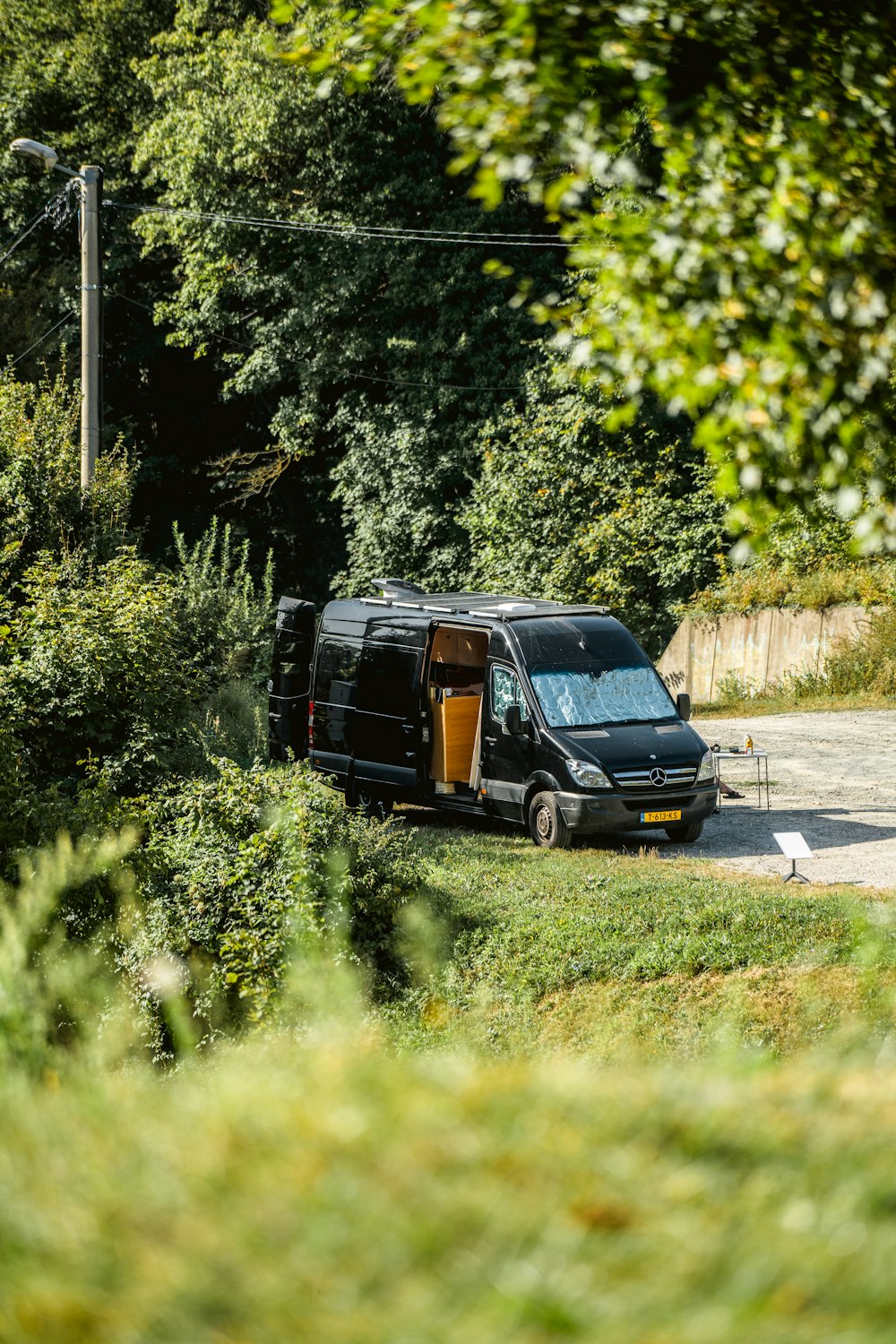 a van is parked on the side of the road