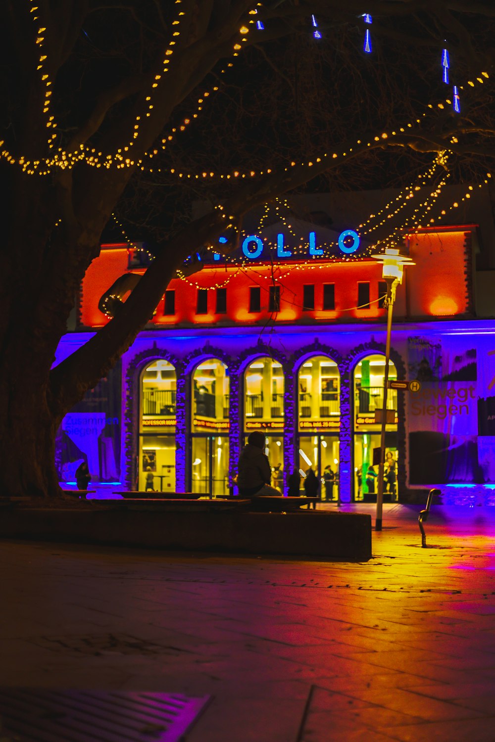 a lit up building with a lot of lights on it