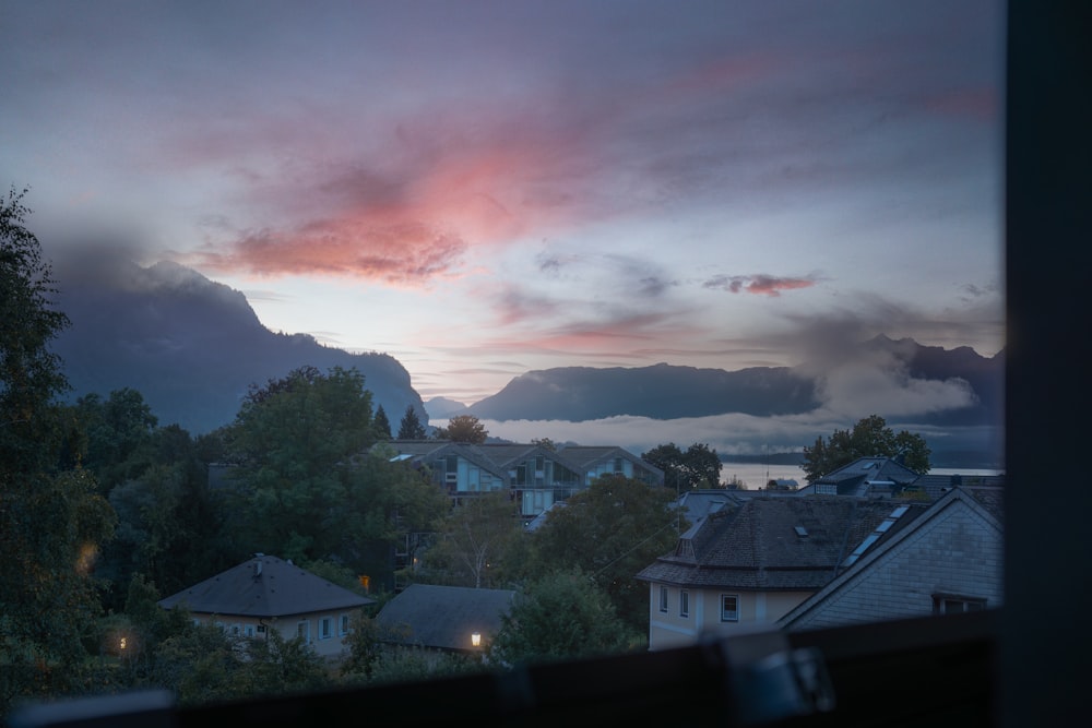 a view of a city with mountains in the distance