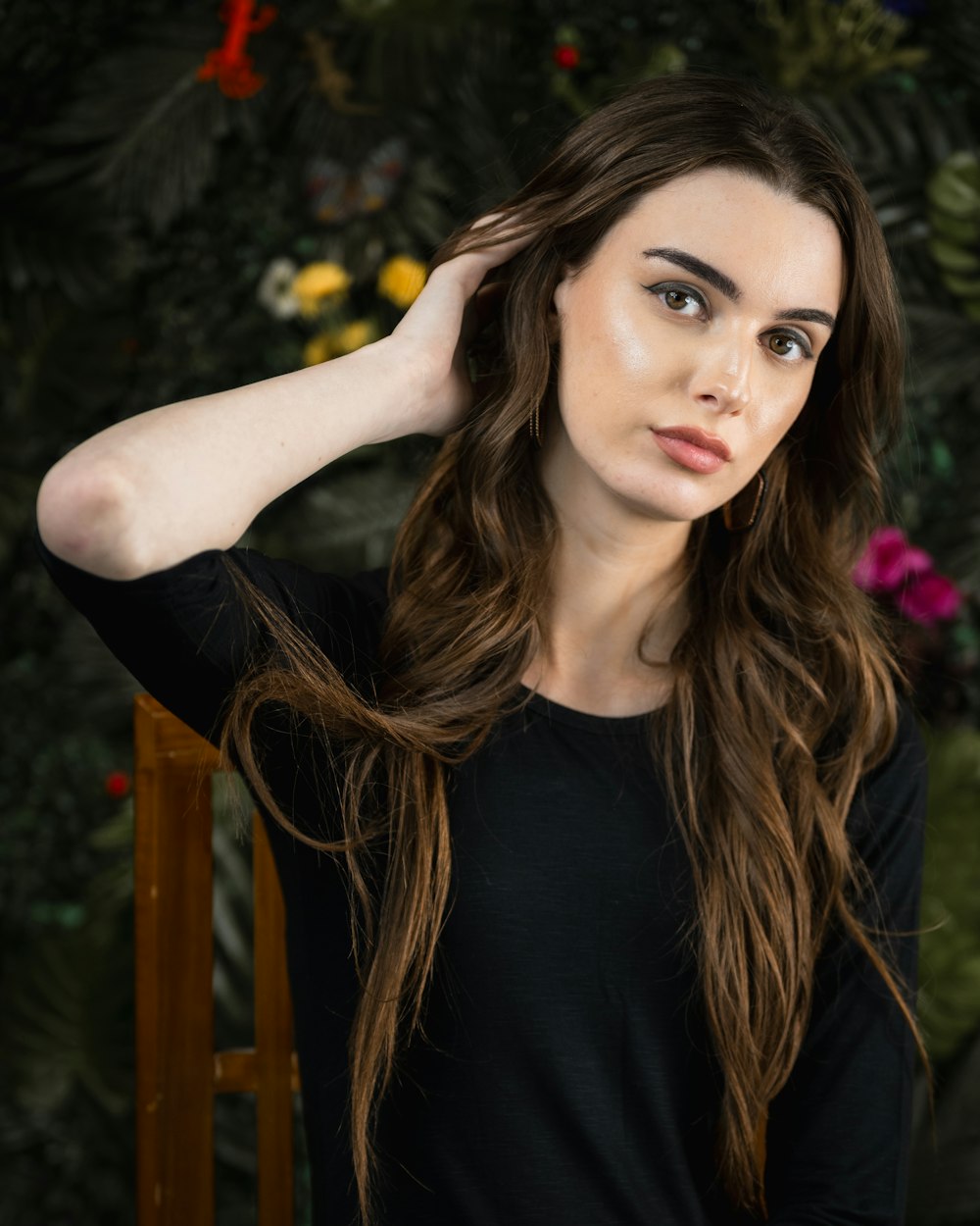 a woman with long hair is posing for a picture