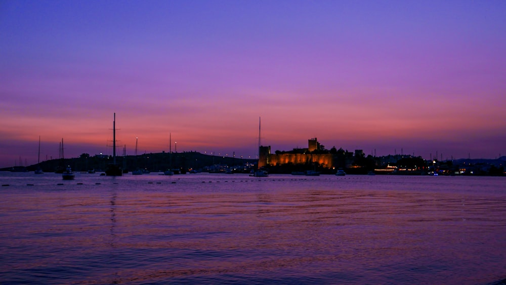 a purple and blue sky over a body of water