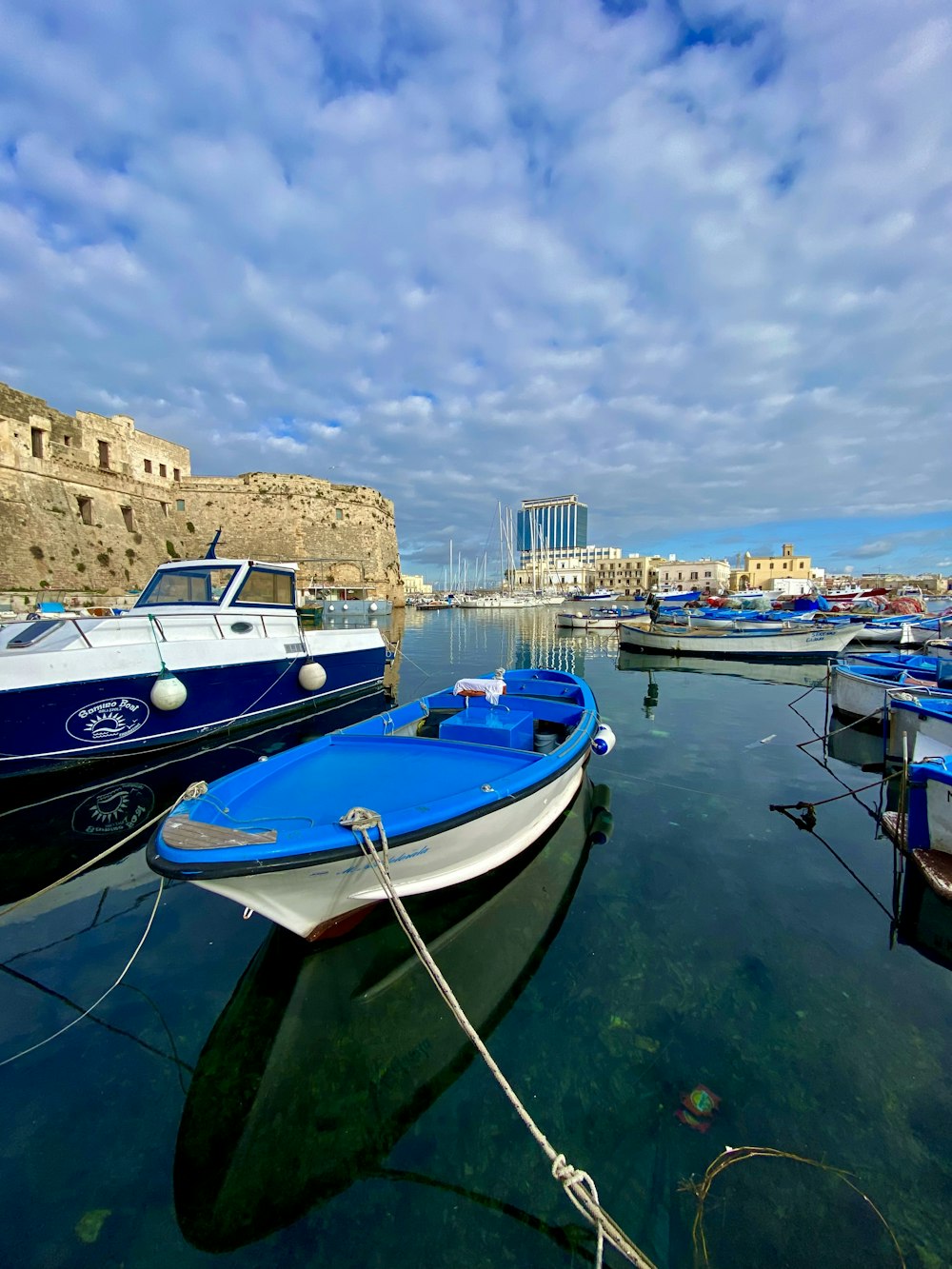 a bunch of boats that are sitting in the water