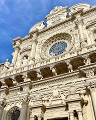 a tall building with a clock on the front of it