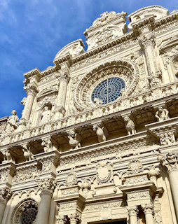 a tall building with a clock on the front of it
