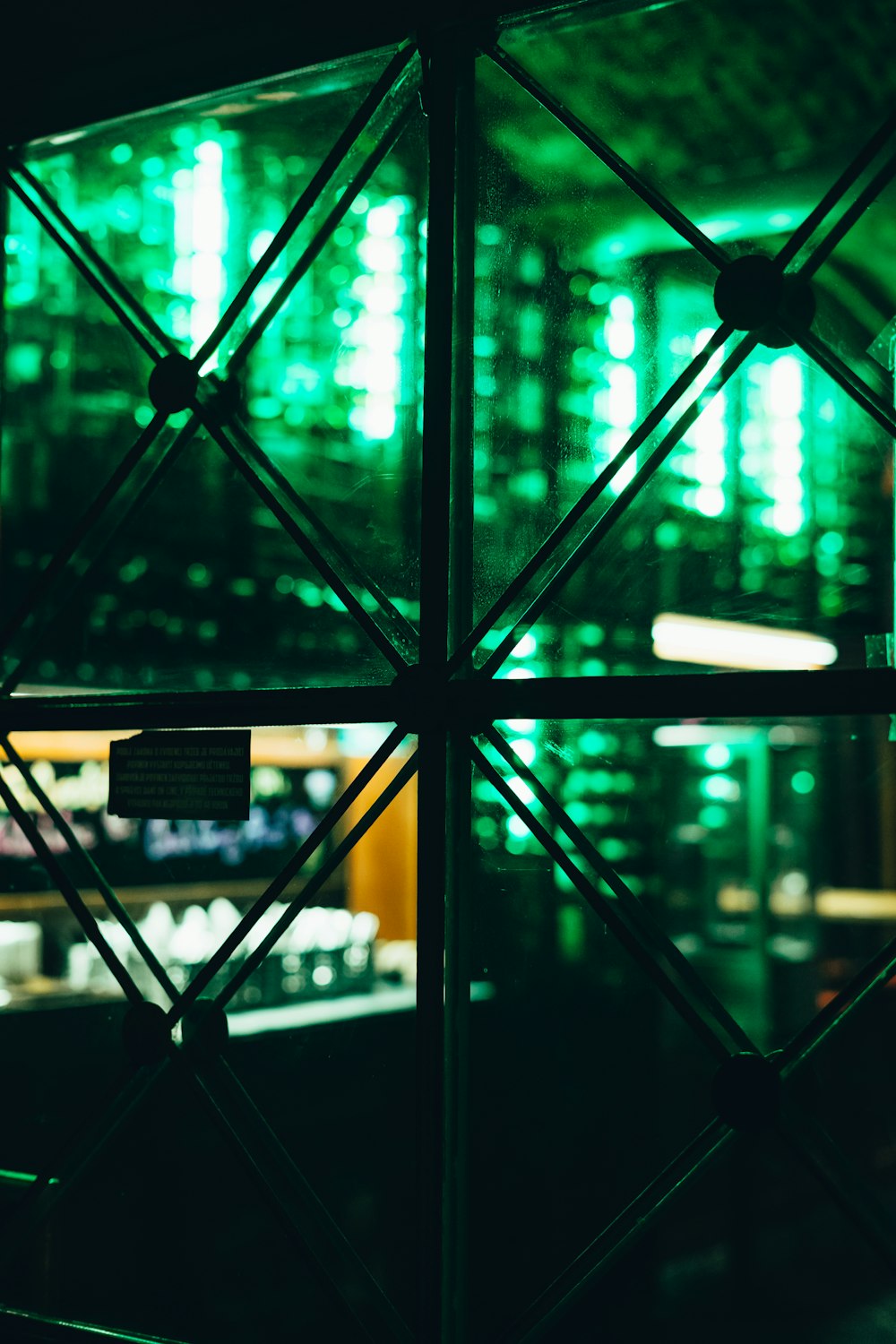 a view of a building through a window at night