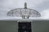a satellite dish mounted on top of a military vehicle