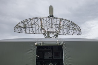 a satellite dish mounted on top of a military vehicle