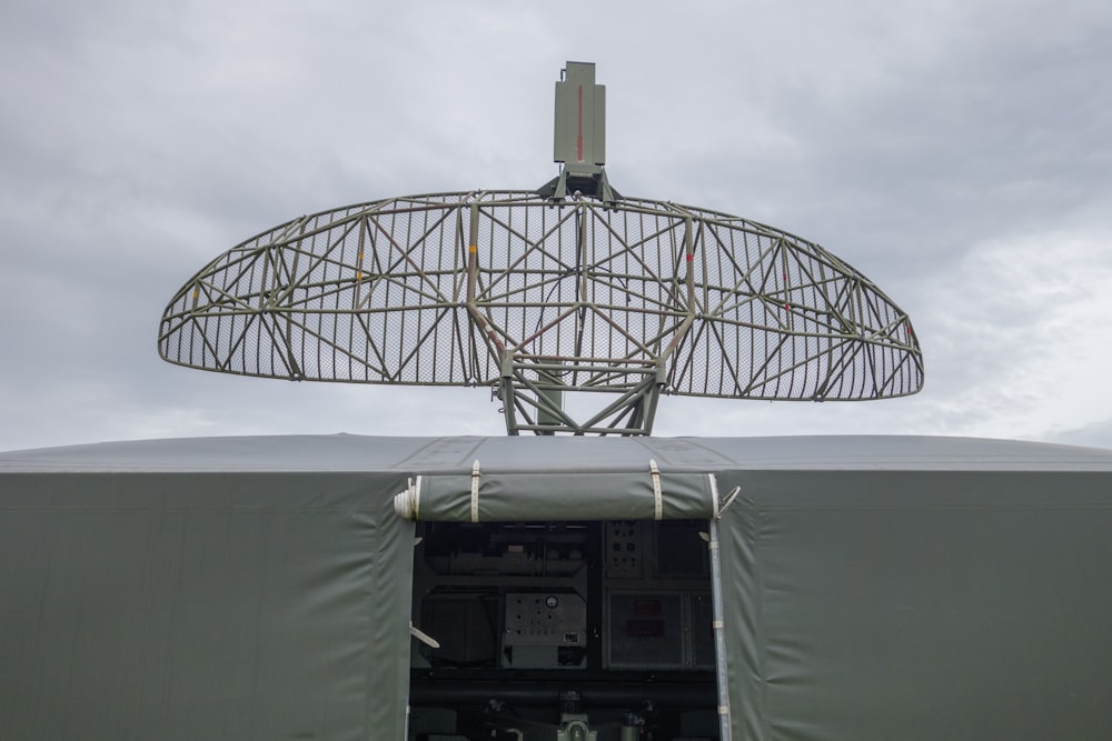 a satellite dish mounted on top of a military vehicle
